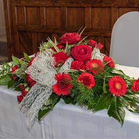 fwthumbVenue Decoration Top Table Arrangement Reds(3).jpg